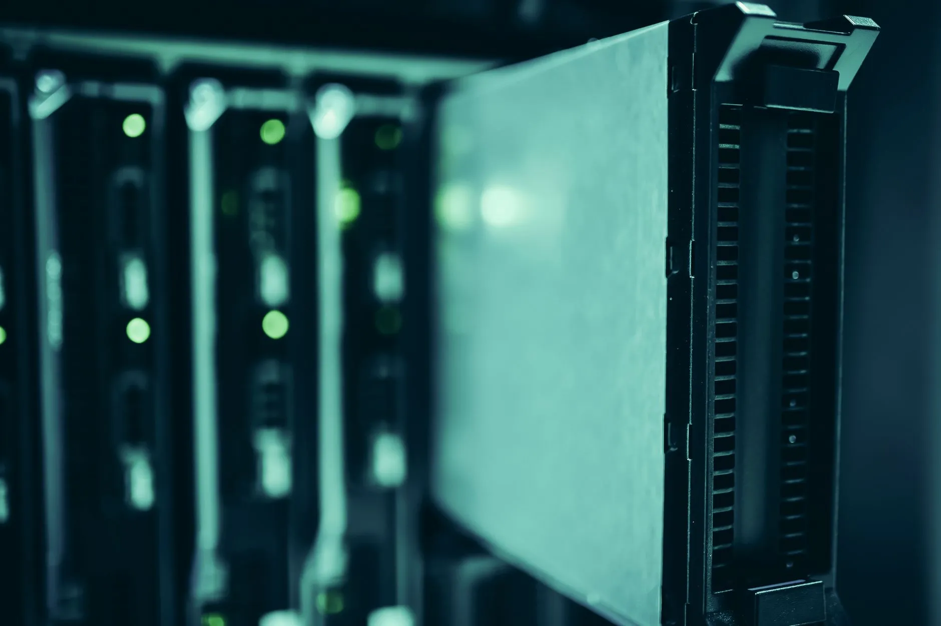 Server racks in a data centre with green status lights